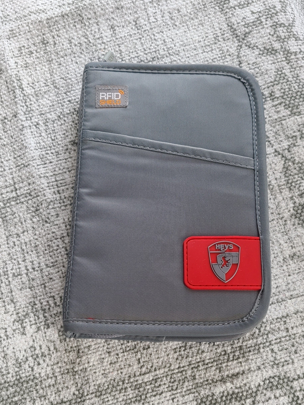 Heys Gray Travel Wallet with Red Accent